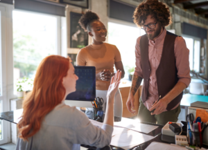 Lawyer talking to her clients at her desk