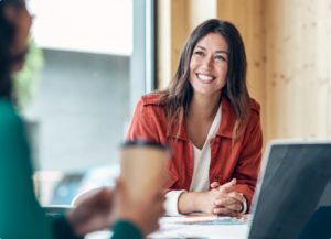 Smiling lawyer teaching her clients about wills and trusts